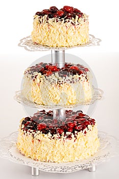 Three-story cake almond with red berries