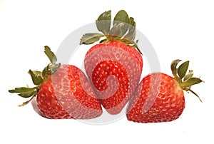 Three strawberries in a white background