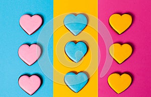 Three strickt rows of colorful gingerbread cookies