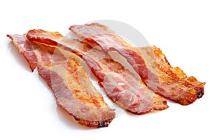 Three strips of fried crispy bacon.