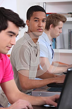 Three students in the library.