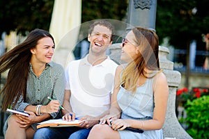 Three students are preparing for exams.