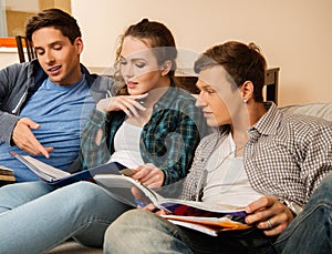 Three students preparing for exams