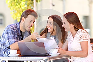 Three students studying and learning in a coffee shop photo