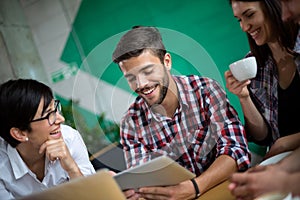 Three students studying on the tablet