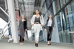 Three successful young women. Concept for business, boss, work and success