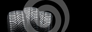 three summer modern tires on a black background. place for advertising and text copyspace photo