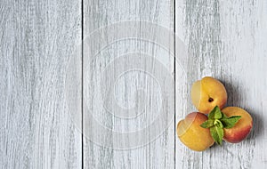 Three sweet fresh apricots on wood empty table rustic top view