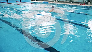 Three swimmers compete in a swimming competition