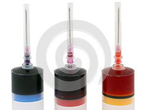 Three syringes with paint