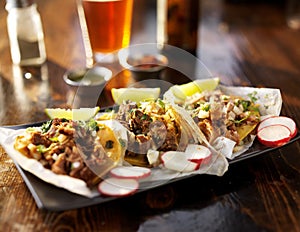 three tacos with beer