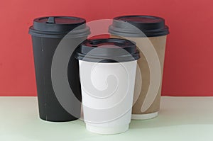 Three take-out coffee in cardboard thermo cup