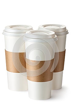 Three take-out coffee with cup holders