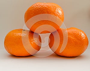 Three Tangerines Podium On White Background