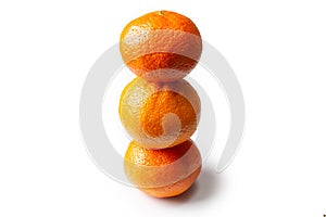 Three tangerines on a white background