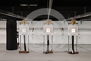 Three targets in black and white indoor shooting range