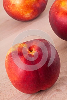 Three tasty fresh ripe juicy nectarines