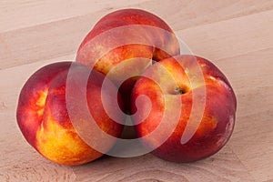 Three tasty fresh ripe juicy nectarines