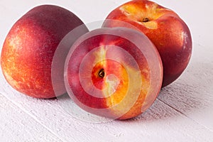 Three tasty fresh ripe juicy nectarines