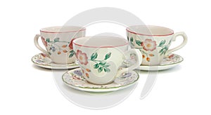 Three tea cups with saucers isolated