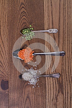 Three teaspoons with different grains.