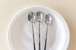 Three teaspoons are on the plate