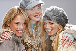 Three Teenage Girls Wearing Knitwear In Studio