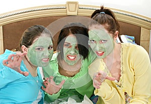 Three Teens In Facial Mask Growling photo