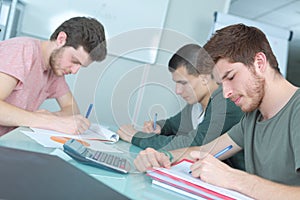 Three teens studying together