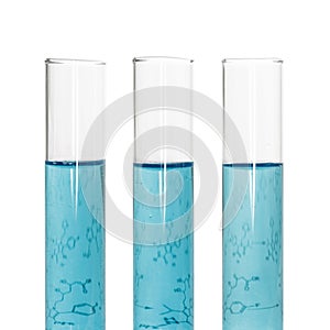 Three test tubes with blue liquids and sheet of paper with formulas isolated on white background.