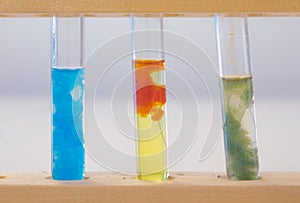 Three Test Tubes Containing Precipitates of Transition Metal Compounds