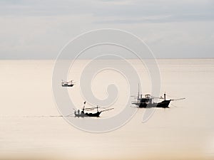 Three thai fisherman boat in the sea