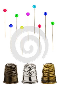 Three thimbles with pins