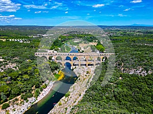 Three-tiered aqueduct Pont du Gard was built in Roman times on the river Gardon and magnificent natural park, Provence photo