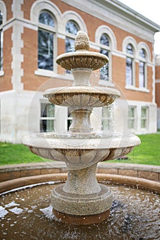 Three Tiered Water Fountain with Wishing Pond in Front of Historic old Building