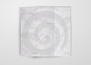 Three times folded white crumpled paper sheet placed on white background. Texture of crumpled paper square card template design