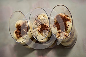 three tiramisu desserts rowed on table