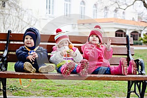 Three toddlers on the bench