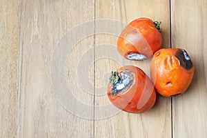 Three tomato rod on wooden board