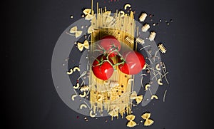 Three tomatoes on pasta