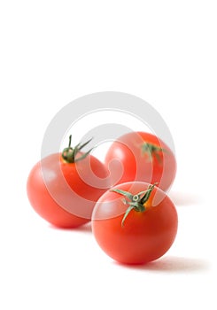 Three Tomatoes on White