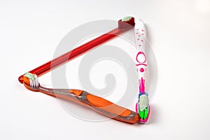 Three toothbrushes for the whole family. Care for the mouth, brushing teeth. Toothpaste and toothbrush