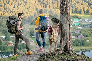 Three tourists aking decission where to go photo