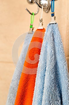 Three towels hanging on a hook