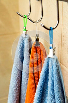 Three towels hanging on a hook