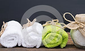 Three towels stacked and tied with rope, and on top of a place for