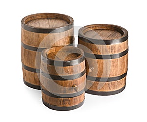 Three traditional wooden barrels on white