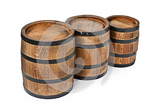 Three traditional wooden barrels on white