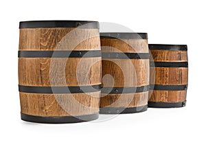 Three traditional wooden barrels on white background