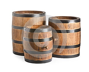 Three traditional wooden barrels on white